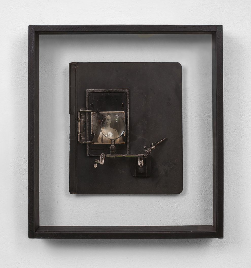 POSSESIA / Origins - Document 03 / 
2012 / 49 x 54 x 9 cm /
vintage photograph print, document board, polyvinyl acetate, magnifying glass, soil, wood and glass box frame